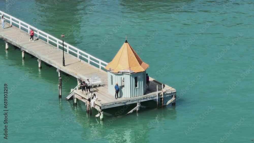 Aerial: Wharf in seaside town of Akaroa, Canterbury, New Zealand Aerial: Wharf in seaside town of Akaroa, Canterbury, New Zealand