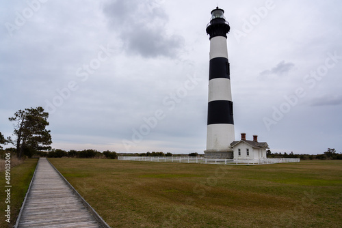 View of Wodden path to the horizon with large light house on the side