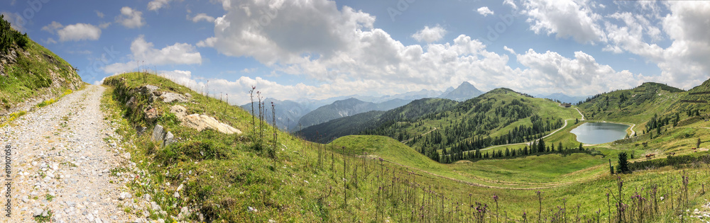 Panorama Nature of Mountain, Grass and Lake in Flachau. Beautiful Outdoor Scene in Austria during Summer Day.
