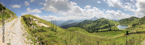 Panorama Nature of Mountain, Grass and Lake in Flachau. Beautiful Outdoor Scene in Austria during Summer Day.