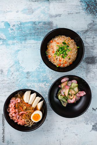 Rice with chicken, dashi broth with shrimp and sunomono salad with cucumber and radish.