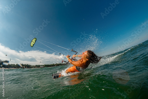 A kite surfer rides the waves