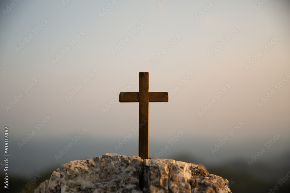 Crucifixion Of Jesus Christ - Cross At Sunset. Silhouette cross on Calvary mountain sunset background. Easter concept