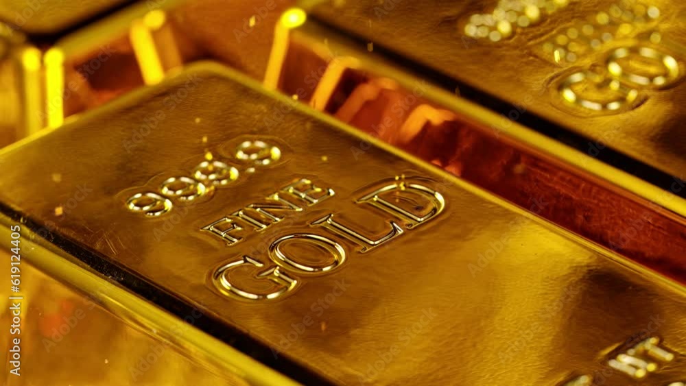 Gold bars with falling glitters, super slow motion filmed on high speed cinematic camera at 1000 fps Gold bars with falling glitters, super slow motion filmed on high speed cinematic camera at 1000 fps