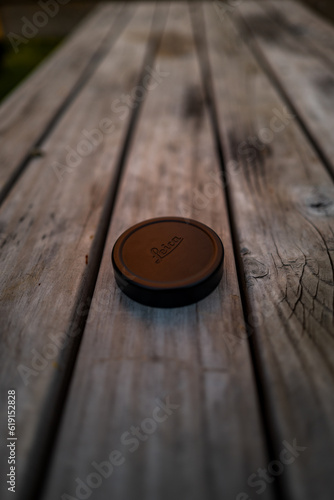 Leica lens hood on wooden table