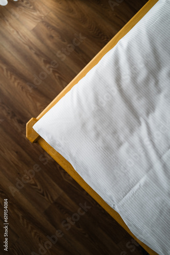 fresh sheets and a wooden floor