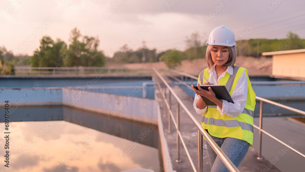 Environmental engineers work at wastewater treatment plants,Water supply engineering working at Water recycling plant for reuse,Technicians and engineers discuss work together.