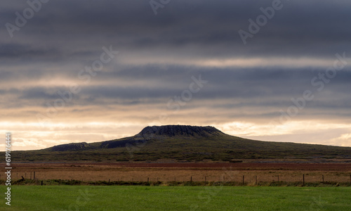 Eldborg crater at sunset with dramatic sky, Iceland photo