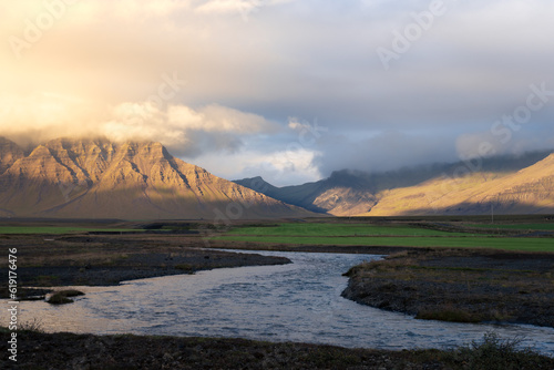 Scenic view of countryside at Snaefellsnes peninsula, Iceland. River and mountains at sunset