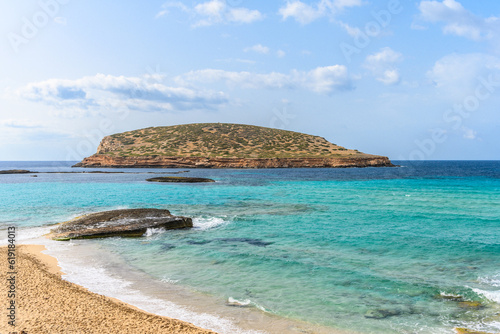 Empty Cala Comte beach in Ibiza on a sunny spring day