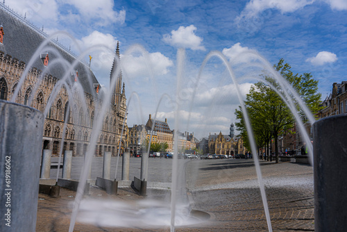Fényképezés Fountains in the market square of Ypres on a beautiful sunny day
