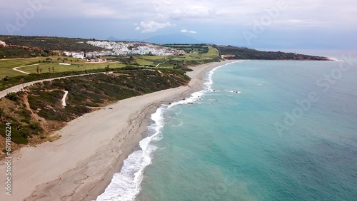 aerial view along the coast of the Mediterranean Sea with the beach Playa Alcaidesa and the golf course in La Alcaidesa, Andalusia, Malaga, Spain