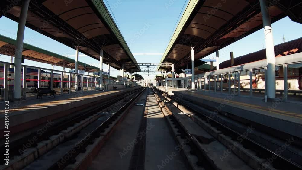 4K drone going advancing and ascending forward over railway tracks, platforms and train station stock video. 4K drone going advancing and ascending forward over railway tracks, platforms and train station stock video.