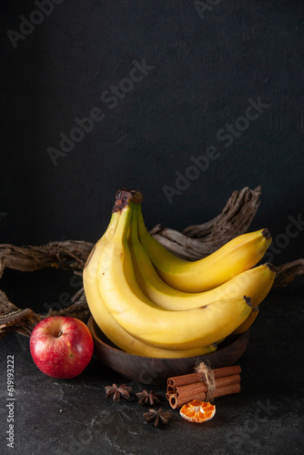 front view fresh yellow bananas on dark background exotic ripe food darkness taste photo tropical fruit