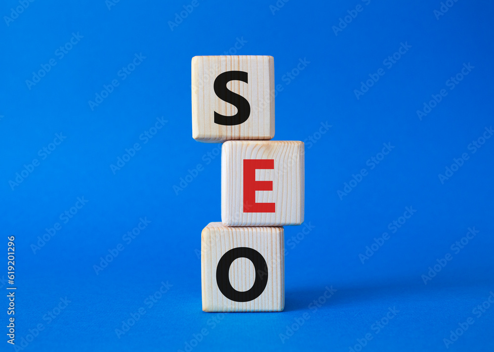 SEO - Search Engine Optimization symbol. Wooden blocks with words SEO. Beautiful blue background. Business and SEO concept. Copy space. SEO - Search Engine Optimization symbol. Wooden blocks with words SEO. Beautiful blue background. Business and SEO concept. Copy space.
