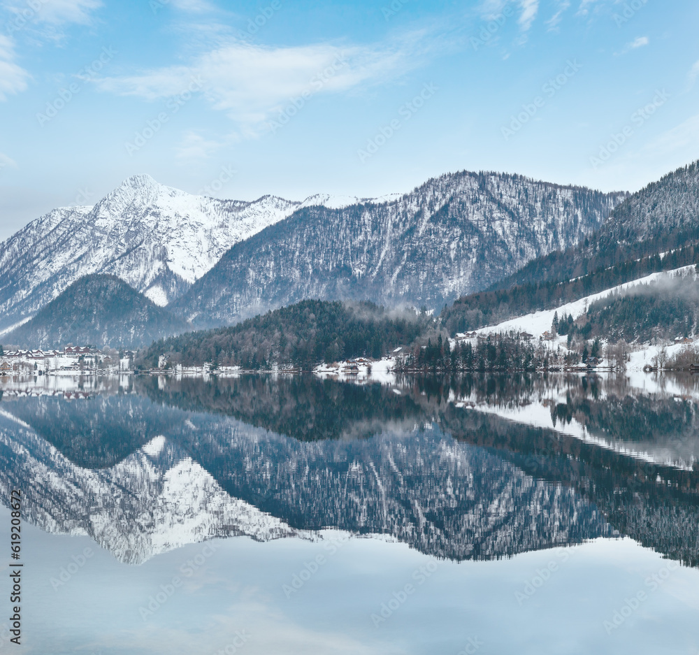 Cloudy winter Alpine  lake Grundlsee (Austria) with fantastic pattern-reflection on the water surface.