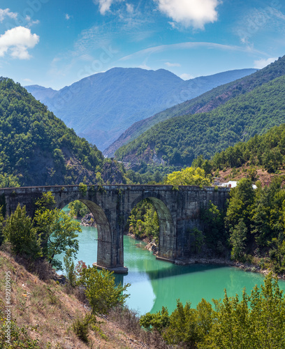 Ura e Ulzes bridge on one of most beautiful roads in Albania along the Shkopet Lake precipitous сoast. Lake Ulza Nature Park, Diber County, Balkan mountains, Albania, Europe.