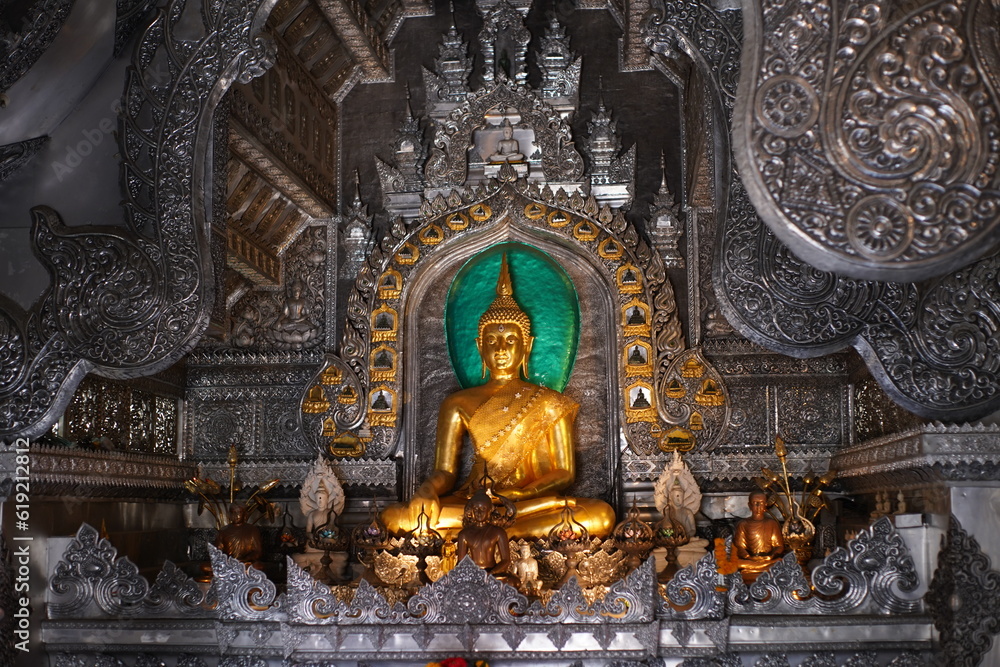 Seated Buddha in a silver temple