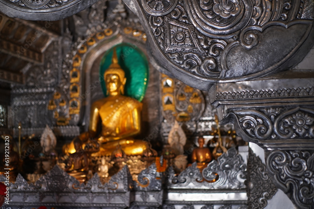 Seated Buddha in a silver temple