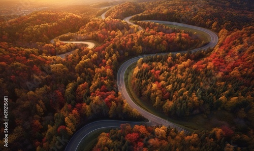  an aerial view of a winding road surrounded by autumn trees.  generative ai © Anna