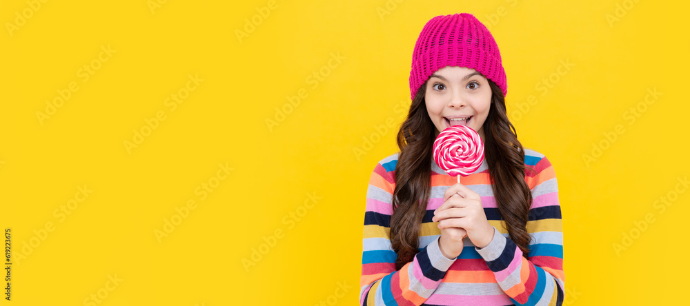 cheerful teen girl eating lollipop candy. Teenager child with sweets, poster banner header, copy space.