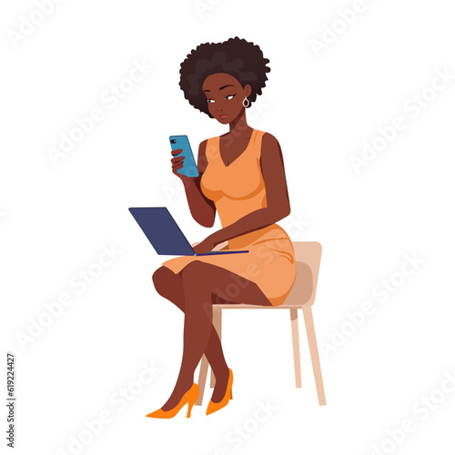 black girl businesswoman looking at laptop and smartphone