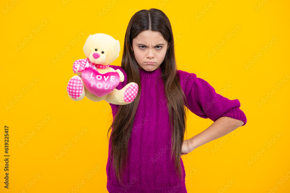 Childhood, toys and kids. Cute teen girl cuddling fluffy toy. Angry teenager girl, upset and unhappy negative emotion. Childhood, toys and kids. Cute teen girl cuddling fluffy toy. Angry teenager girl, upset and unhappy negative emotion.