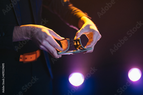 Man showing magic trick on stage photo
