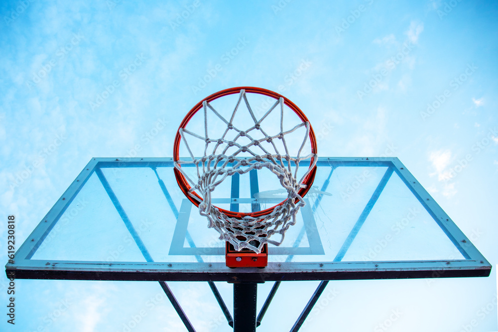 basketball hoop bottom view against the sky