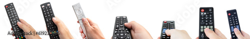 TV remote controls in hand, multiple transparent set