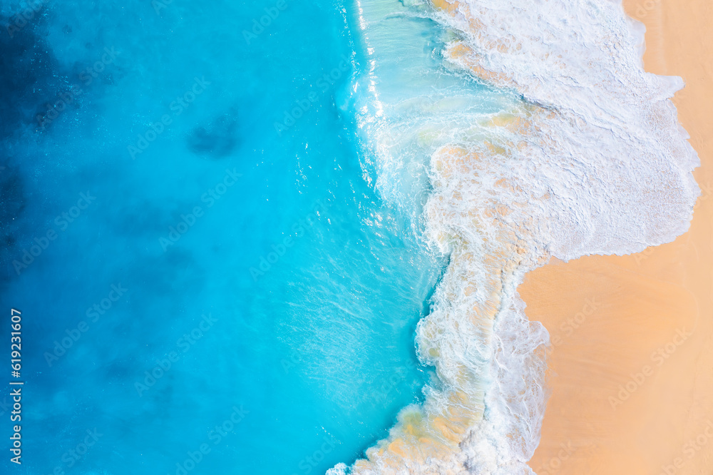 Coast as a background from top view.  Waves and beach. Aerial landscape. Azure water background from drone. Summer seascape from air. Vacation time.