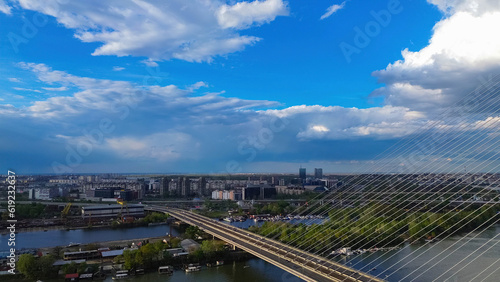 Belgrade, Serbia - April 15th 2023 aerial photo from above of New Belgrade district across the Ada Bridge on a cloudy day