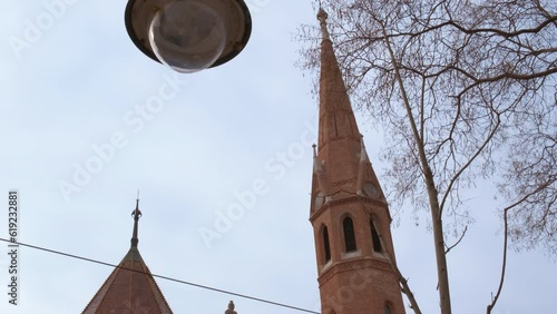 Budapest Szilagyi Dezso Square Reformed Church. A view of nice Deje Silady Square with reformed church in Hungary against grey sky. photo