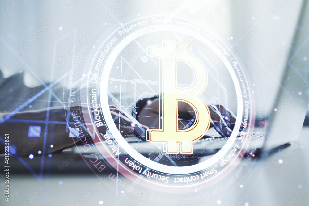 Double exposure of creative Bitcoin symbol with hands typing on laptop on background. Cryptocurrency concept Double exposure of creative Bitcoin symbol with hands typing on laptop on background. Cryptocurrency concept