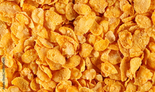 Crunchy corn flakes, cereal, muesli pile background and texture, top view photo