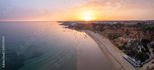 Aerial Seascape and Coastline Cliffs of Praia do Barranco das Belharucas beach, in Algarve Region a Worldwide Popular Beach and Nature Destination, in South Portugal.