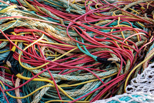multicoloured trawl ropes and nets with drawn ropes and footrope