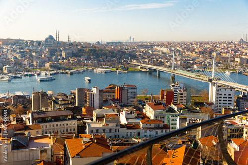 View from Galata Tower of Golden Horn bay with cable-stayed metro bridge connecting Beyoglu and Fatih districts, Suleymaniye Mosque in background, Istanbul, Turkey.. photo