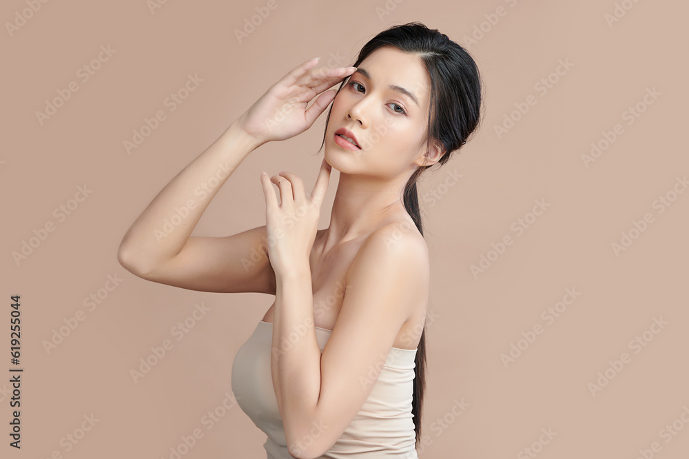 Beautiful young asian woman with clean fresh skin on beige background, Face care, Facial treatment, Cosmetology, beauty and spa, Asian women portrait. Beautiful young asian woman with clean fresh skin on beige background, Face care, Facial treatment, Cosmetology, beauty and spa, Asian women portrait.