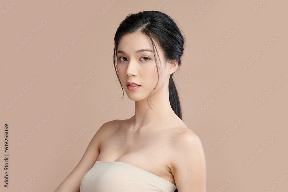 Beautiful young asian woman with clean fresh skin on beige background, Face care, Facial treatment, Cosmetology, beauty and spa, Asian women portrait. Beautiful young asian woman with clean fresh skin on beige background, Face care, Facial treatment, Cosmetology, beauty and spa, Asian women portrait.