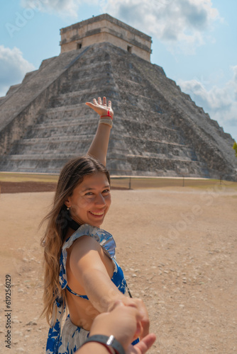 Beautiful young couple enjoying their vacation in the archaeological zone of Chichen Itza