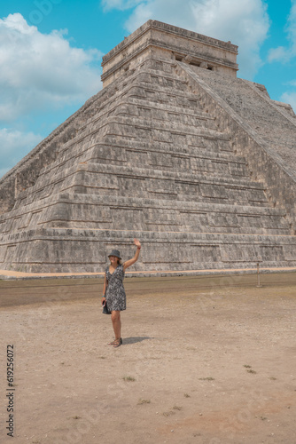 woman visits one of the most beautiful pyramids in the world, the pyramid of chichen itza in mexico 