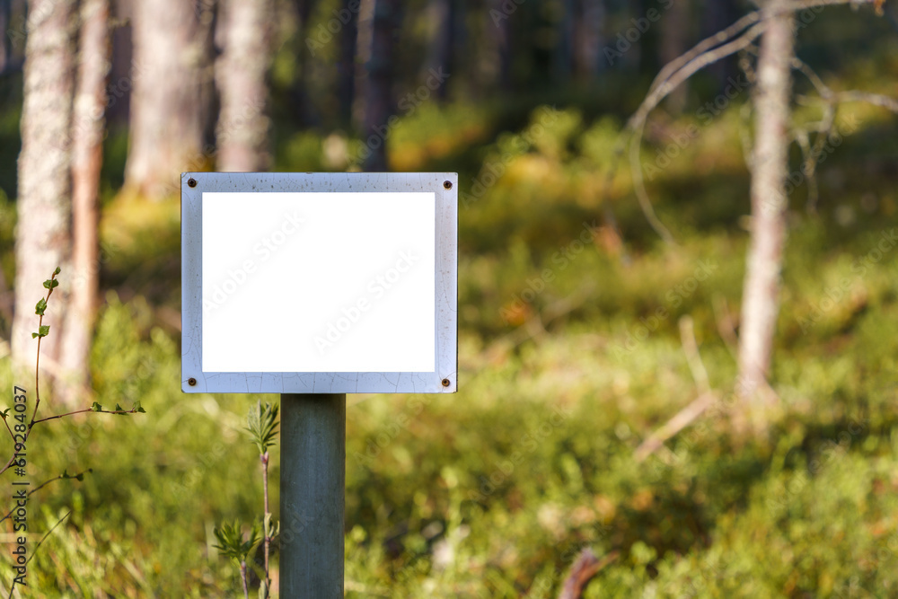 Empty white sign in forest