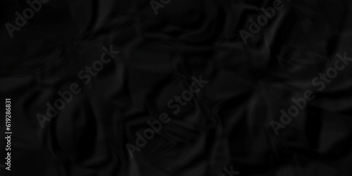 Black fabric texture and Crumpled black paper for background image. top view. black satin background