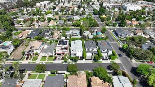 Sherman Oaks city suburb of Los Angeles aerial view flying over sunny neighbourhood rooftops photo