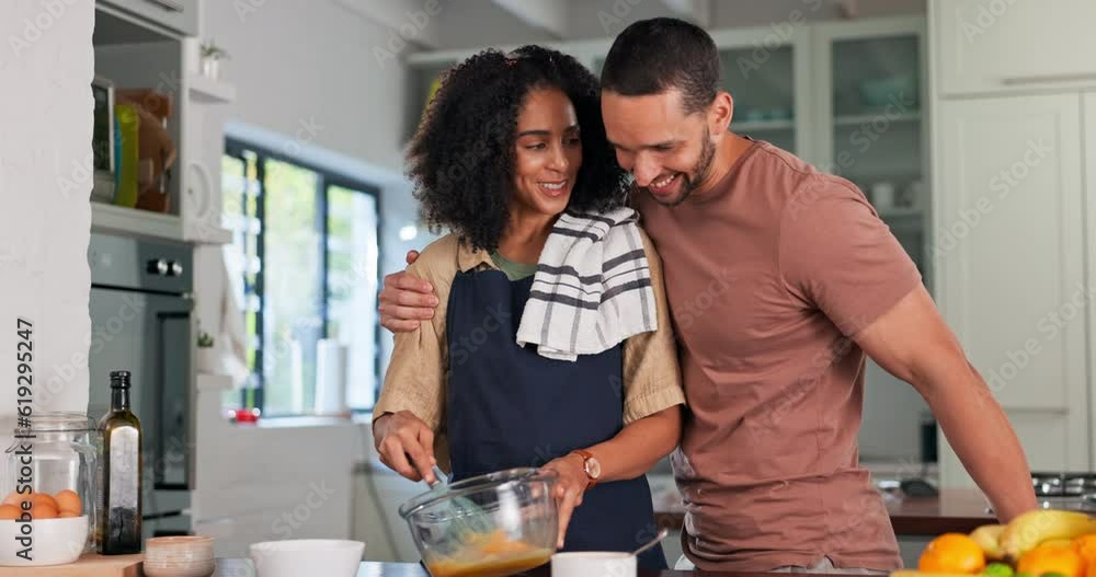 Couple, hug and happy cooking in kitchen for love, care and quality time together at home. Smile, embrace and young man with woman prepare food for lunch meal, dinner and romantic bond in apartment Couple, hug and happy cooking in kitchen for love, care and quality time together at home. Smile, embrace and young man with woman prepare food for lunch meal, dinner and romantic bond in apartment
