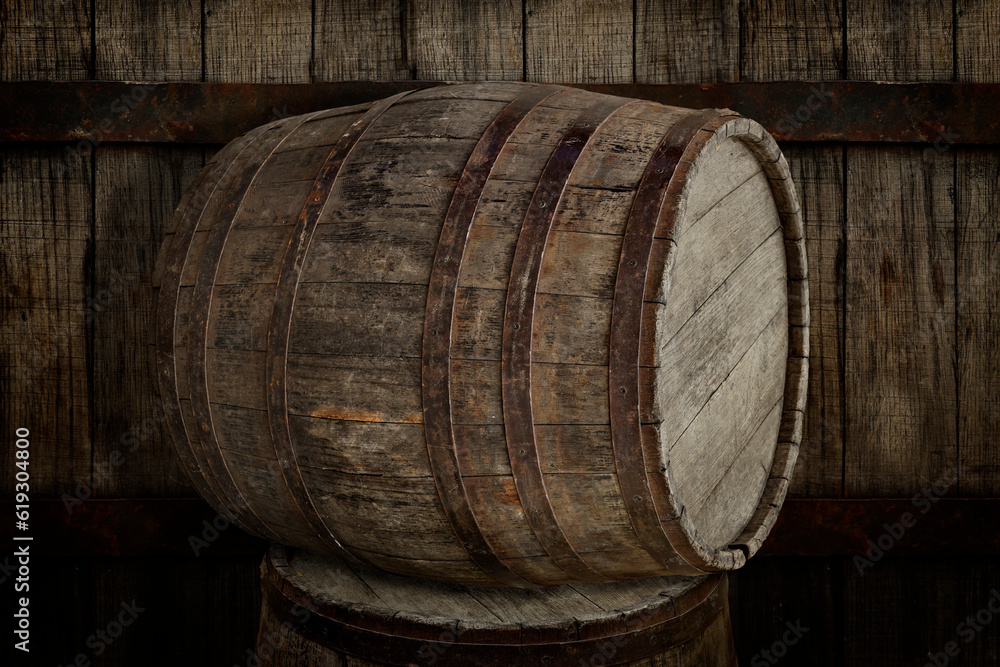 Two wooden barrels near old textured wall