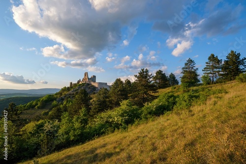 The ruins of castle Cachtice. Landscape at sunset with blue sky and clouds. Slovak mountains and national parks