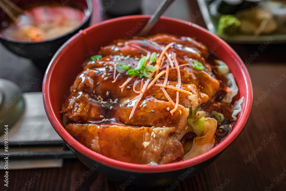 Japanese chicken teriyaki with rice and vegetables. Plate of teriyaki chicken with rice on the table, top view Japanese chicken teriyaki with rice and vegetables. Plate of teriyaki chicken with rice on the table, top view