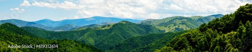 Fototapeta Naklejka Na Ścianę i Meble -  panorama over green hills, Calugaru hills, Cindrel mountains, Sibiu county, Romania